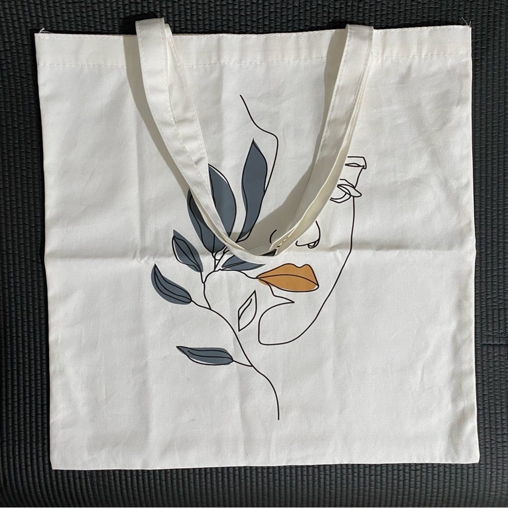 Stylish Cream Tote Bag with Artistic Design